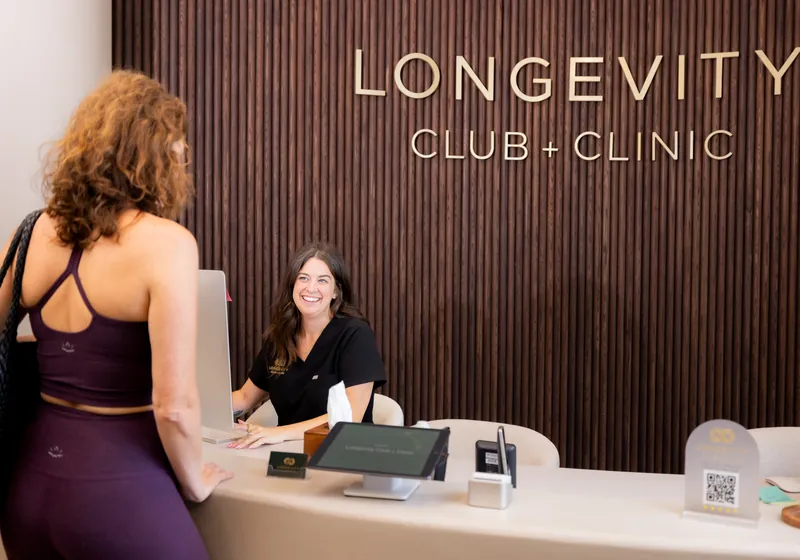 Checking in at the front desk of The Longevity Club + Clinic in Franklin, TN